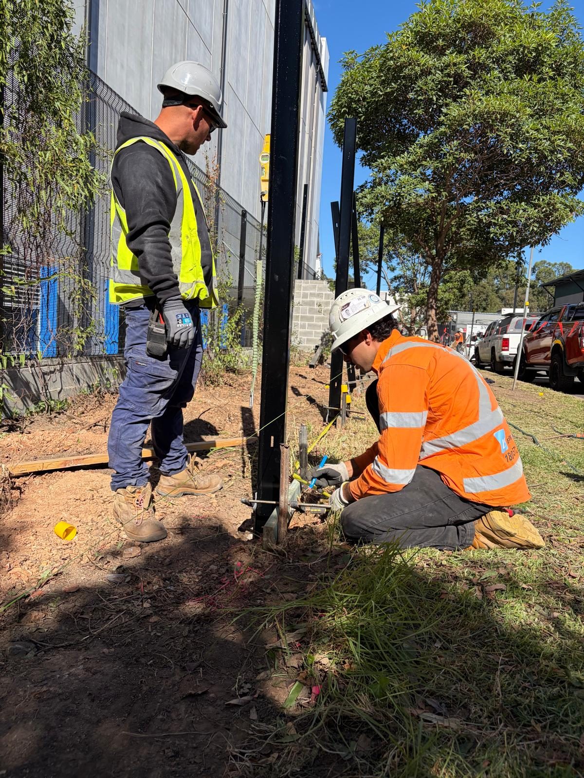 LS Fencing: ls fencing crew installing security fence
