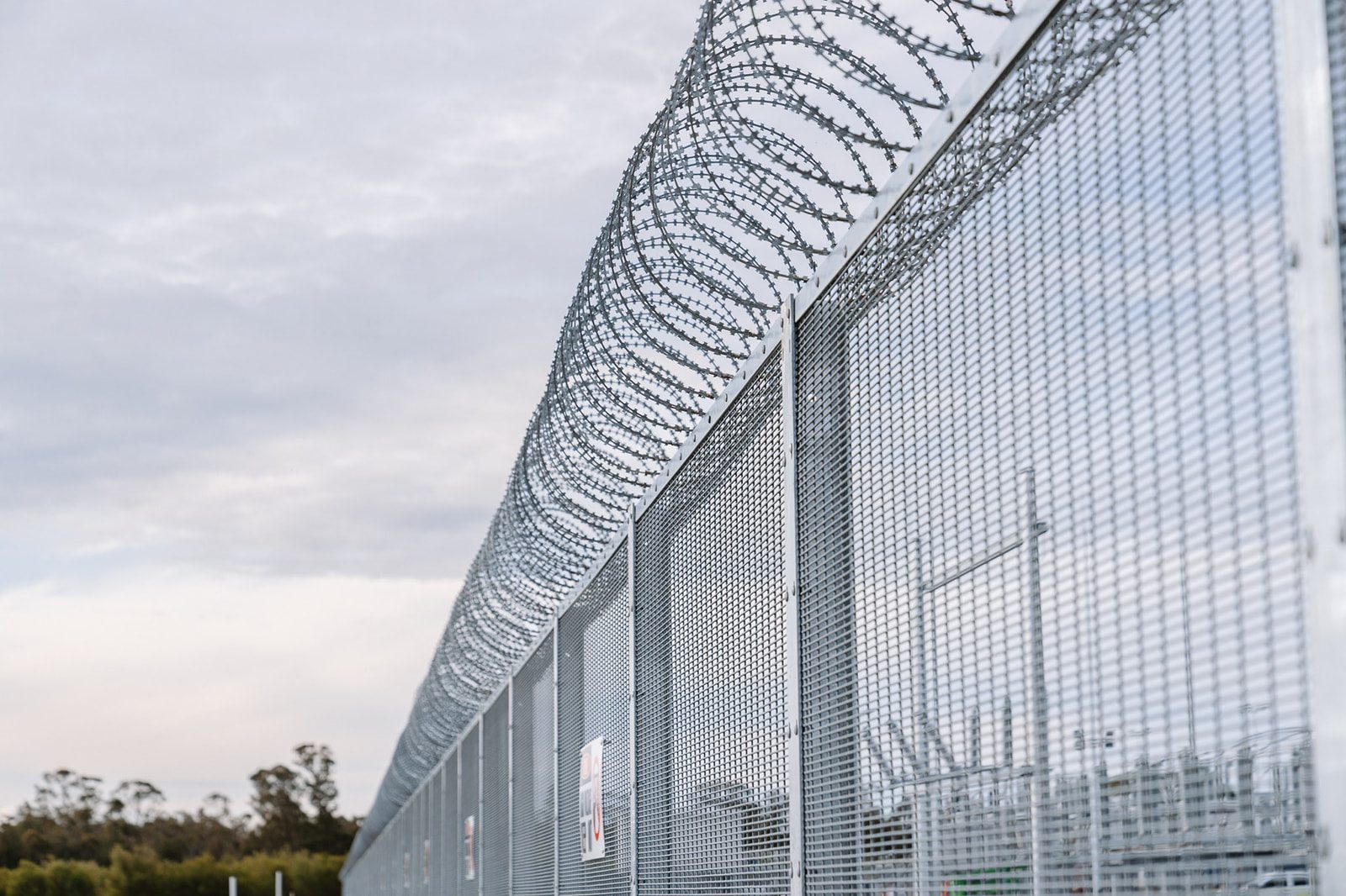 LS Fencing: razor wire topping on substation security fence