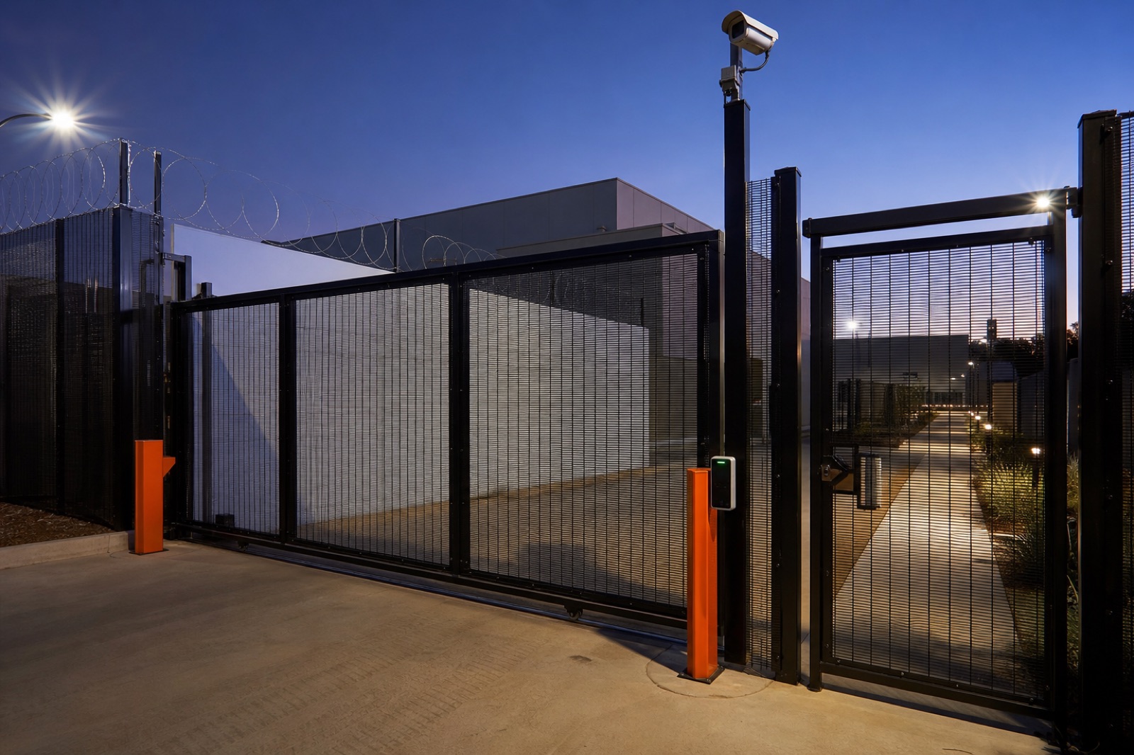 Automated security gate with access control, CCTV and lighting for a commercial site.