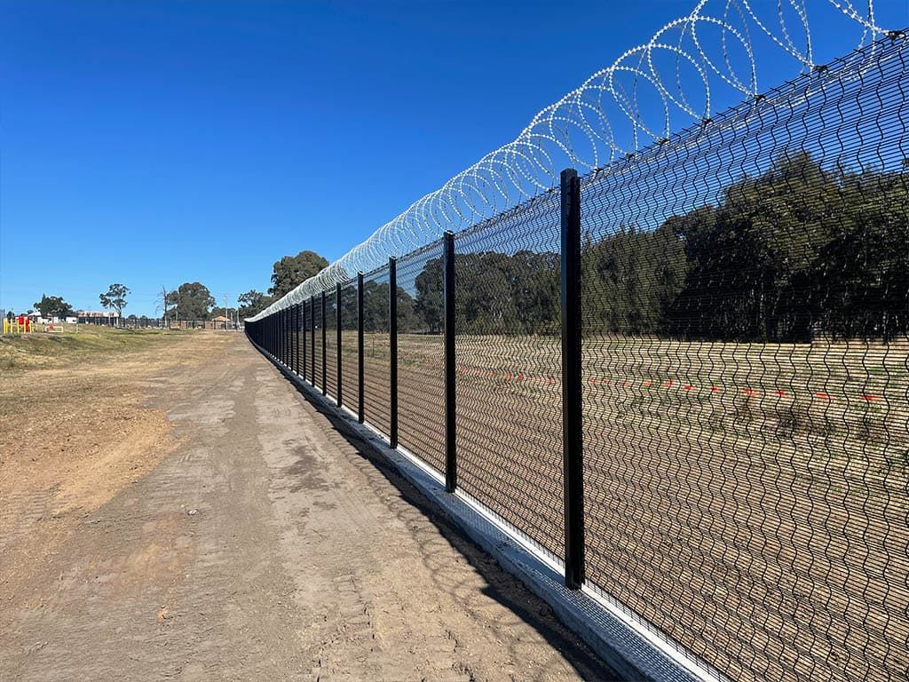 Jemena gas compound, Horsley Park: razor wire topping on the security perimeter