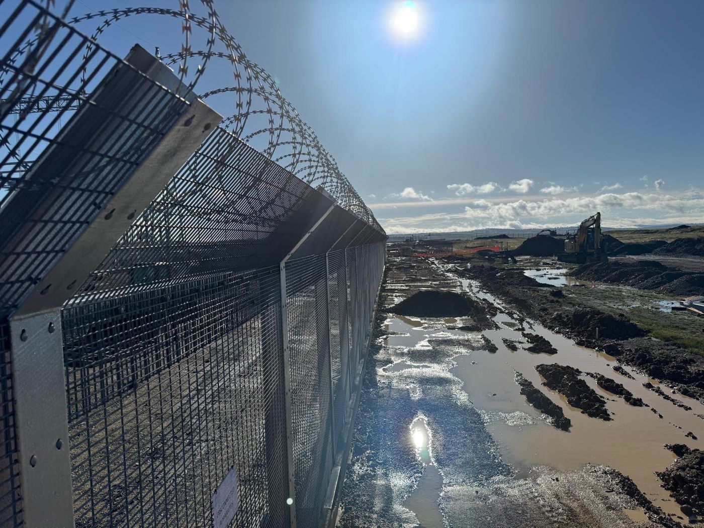 New England Solar Farm, Uralla: 3 metre high security fencing with razor wire and concrete plinth for TransGrid
